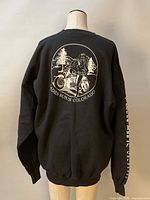 Back view showing large motorcycle graphic and text