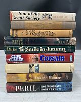 Spine view of stacked books showing titles