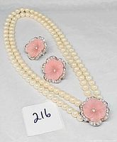 Set laid out showing entire double strand necklace and both earrings