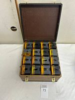 open carry case showing 16 slide trays neatly stored