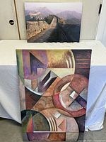 Both canvas prints upright: abstract piece in front, Great Wall photograph behind