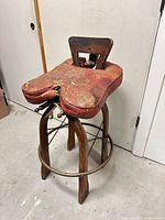 Full view of camel saddle-style bar stool front/side
