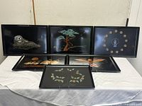 All six Couroc trays displayed to show size and motifs