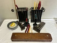 overview of all candle molds, holders, candles and wooden holder