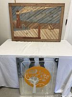 Both pieces: wood mosaic lighthouse scene above, decorative mirror below