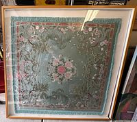 Full view of framed tapestry showing overall design and frame