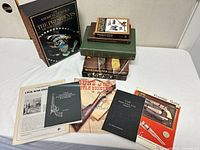 Group shot of all 13 books and pamphlets including boxed Presidents set and firearms titles