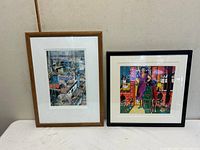 Two framed artworks side by side