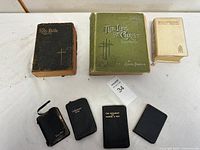 Group shot of eight books showing titles and sizes