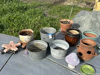 Group shot of all planters, buckets, caddies and ornament