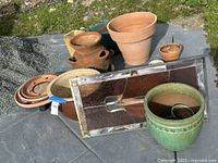 Group shot of all planters, saucers, stained glass panel and caddy