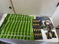 All items laid out: table runner, capes, corn holders, earfunclips