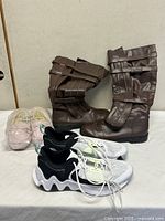 All three footwear pairs displayed side by side