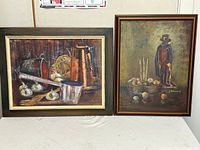 Both framed paintings side by side