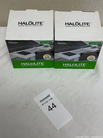 Two retail boxes of Halolite solar lights front view