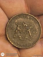 Obverse showing Ontario coat of arms, moose supporters and 1867 date