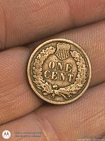 Reverse of 1906 Indian Head cent showing ONE CENT within wreath and shield