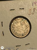 Reverse view showing 10 CENTS CANADA 1918 within maple leaf wreath and crown