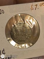 Reverse of 1920 Canada one cent coin in holder