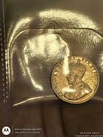 Obverse of 1929 Canada 5-cent coin in plastic flip