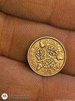 Reverse showing THREE PENCE • 1934 with oak sprigs and acorns