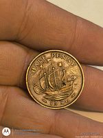 Reverse of 1956 UK half penny showing ship and date