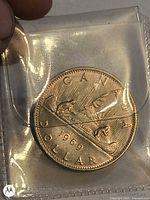 Reverse showing Voyageur canoe design, 1969 date, denomination