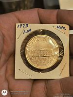 Reverse side of coin showing Province House design and centennial dates in 2×2 holder