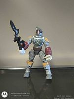 Front view of Boba Fett figure holding sword