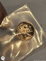 Obverse of dark-toned worn Buffalo nickel in 2x2 flip