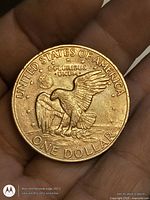 Reverse of 1971 Eisenhower dollar showing eagle landing on moon, denomination and legends