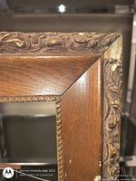 front close-up showing carved molding and missing section