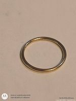 Ring laid flat to show full circular form and finish