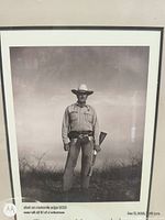 Close-up of framed cowboy photograph showing image detail and Texas Monthly text