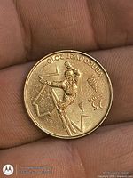 Reverse of coin showing ski-jump design and Vancouver 2010 legend