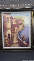 Full view of framed Italian coastal village painting