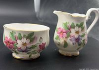 Front view of Royal Albert floral creamer and sugar bowl