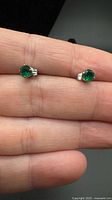 front view of both emerald stud earrings