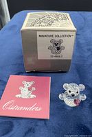 Crystal teddy bear with pink heart, original box showing item number, certificate booklet