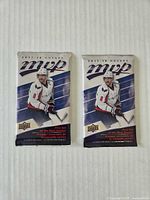 Front view of two sealed 2017-18 Upper Deck NHL MVP packs