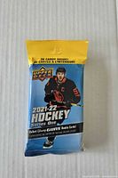 Front of sealed 2021-22 Upper Deck Series One value pack showing branding and 26-card count