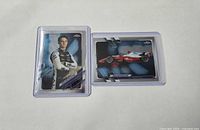 Front view of both Oscar Piastri cards in sleeves