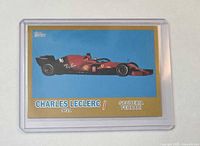 Front of Charles Leclerc gold parallel Topps card in holder