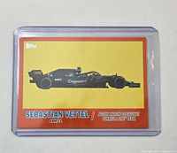 Front of Sebastian Vettel Topps F1 orange parallel card in sleeve