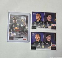 Fronts of three Topps NOW F1 cards including protective sleeves