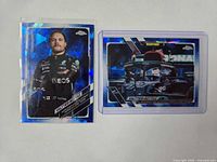 Front view of two Valtteri Bottas 2021 Topps Sapphire cards in holders