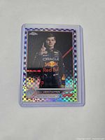 Front of Max Verstappen purple checker flag parallel card in holder