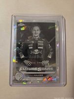 Front of Dennis Hauger Sapphire card in holder