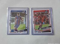 Front view of both Lamine Yamal rookie cards in sleeves