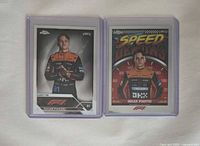 Fronts of both Oscar Piastri cards in sleeves, rookie card left, Speed Demons insert right